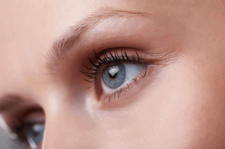 Close-up of a woman’s eye, representing blepharoplasty or eyelid surgery for excess eyelid skin and under-eye concerns.